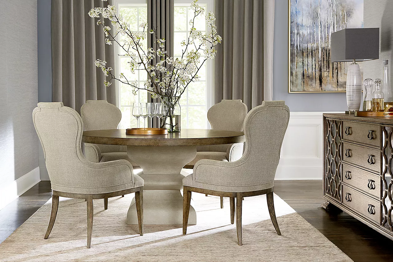 Westcliffe Round Dining Table, Armchairs, and Buffet in Burnished Bark in a room scene.